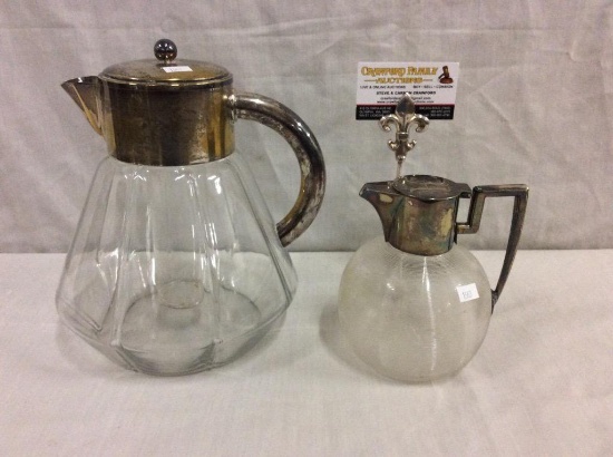 Antique glass carafes with silverplate handles and tops