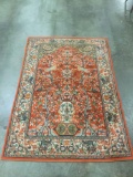 Gorgeous orange and blue patterned rug with tree/flower and bird scene motif