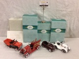 Collection of 4 diecast Hallmark kiddie cars; includes 1935 Garton Pontiac