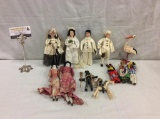 Nice collection of 12 dolls includes a 4 doll wedding set & 2 porcelain doll - various countries and