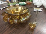 Vintage marigold carnival glass punch bowl with 12 cups and ladle