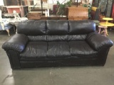 Large dark brown leather couch as is