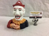Vintage hand painted cast iron jester coin bank
