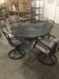 Metal outdoor patio table w/ four cushioned swivel chairs