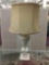 Vintage porcelain flower motif lamp with textured shade and vase/pedestal base