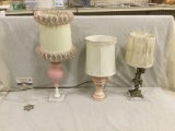 Set of three vintage 50's lamps incl. pink porcelain lamp w/ ruffled shade and bronzed cherub lamp