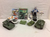 Selection of 11 vintage GI Joe items incl. tanks and car, books and action figure