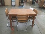 Vintage wooden kitchen table with 3 mid century vinyl and cane back chairs