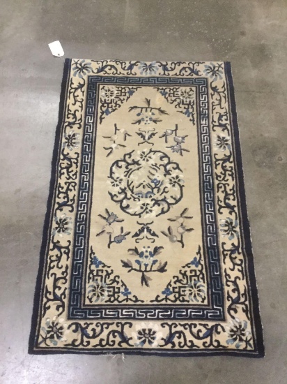 Small vintage blue & off white rug with asian influence pattern
