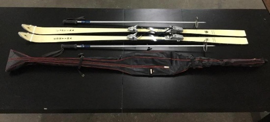 a pair of Cortana snow ski's w/ solaman bindings and PK poles, used