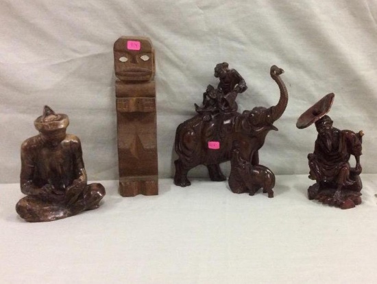 Set of hand carved wooden pieces incl. tribal style totem, two asian men & elephant figurine