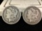 2 silver Morgan dollars, 1881-O and @ 1882-O