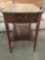 Vintage mahogany Mersman glass top curved drawers end table