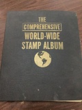 The Comprehensive world wide stamp album, copywrite1952, packed w/ stamps, see pics