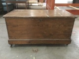 Antique wood chest on wheels w/ lock and key