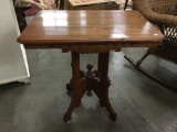 Antique reproduction mid 1800's style oak top side table with ornate detail