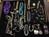 Large collection of estate necklaces, bracelets, and brooches