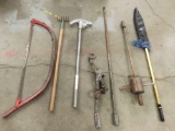 7 long handled tools incl. saw, rake, fishing net, puller, pipe bender etc