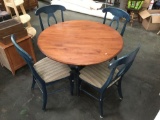 Modern rustic oak top round kitchen table with 4 blue upholstered chairs & leaf