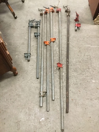 Collection of eight pole clamps in various sizes