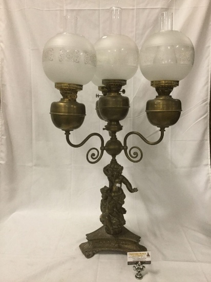 Antique brass oil lamp w/ four globe hurricane shade lights & cherub design base