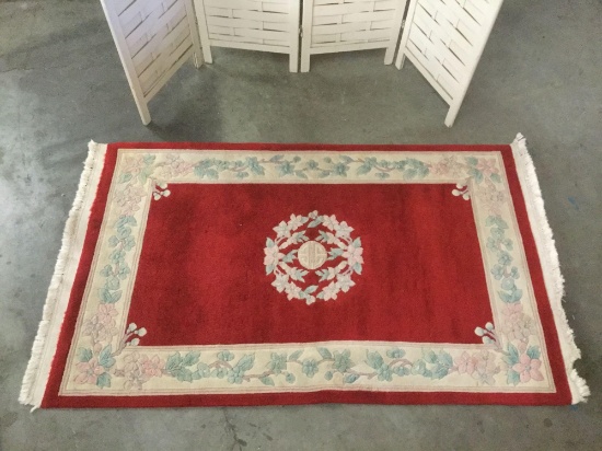 Unmarked plush Chinese red wool rug with classic flower design