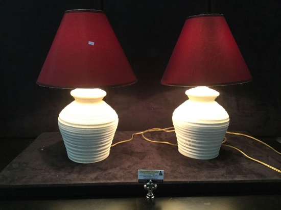 Pair of matching table lamps with ceramic base and red shade