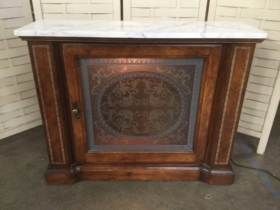 Lovely marble top etched glass front lighted wood cabinet with burled veneer front
