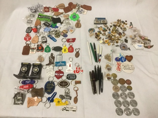 Collection of keychains, commemorative coins, buttons/lapel pins - mostly law enforcement related