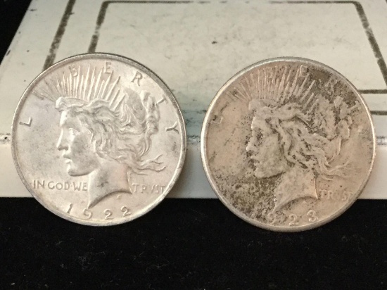 1922 and a 1923-S silver Peace dollars