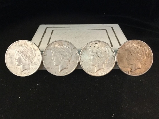 2 1922, a 1923, and a 1926 silver Peace dollars, 4 coins total