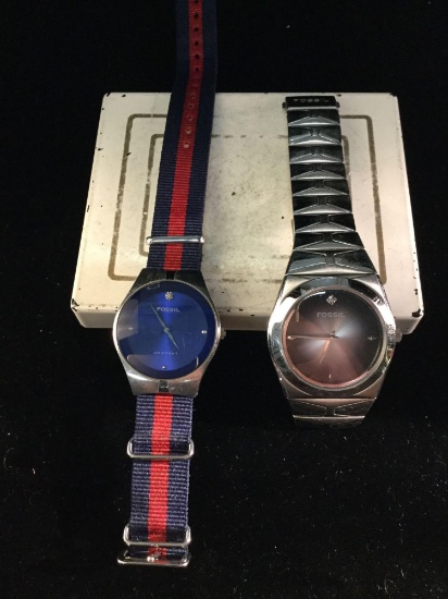 2 Fossil Arkitekt men?s watches, a blue face and a black face