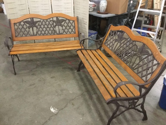 Pair of matching iron and wood benches with coconut tree motif