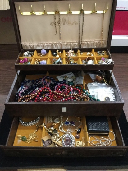 A vintage jewelry box filled with estate jewelry, see pics