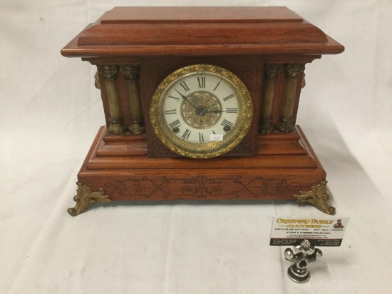 Antique mantle clock with wood case, brass lion handles and Bakelite columns - marked ST