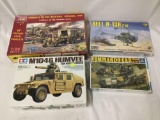 4 assorted military vehicle model kits 1/35 scale - ICM Serbian Army, Revell Bell, Tamiya Humvee etc