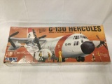 Unopened MPC C-130 Hercules model kit with 11 bonus crewmen, 1/72 scale + more