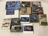 13 assorted model kits, 1/35 scale. Boat, tank conversion kits, ammo, wings, etc