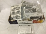Box of assorted model kits, without boxes. Most include instructions and decals, no boxes. As is