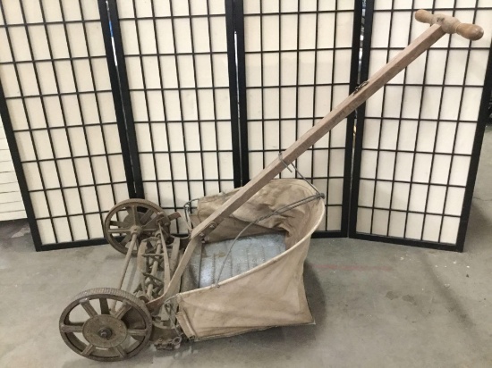 Vintage push lawn mower with bag