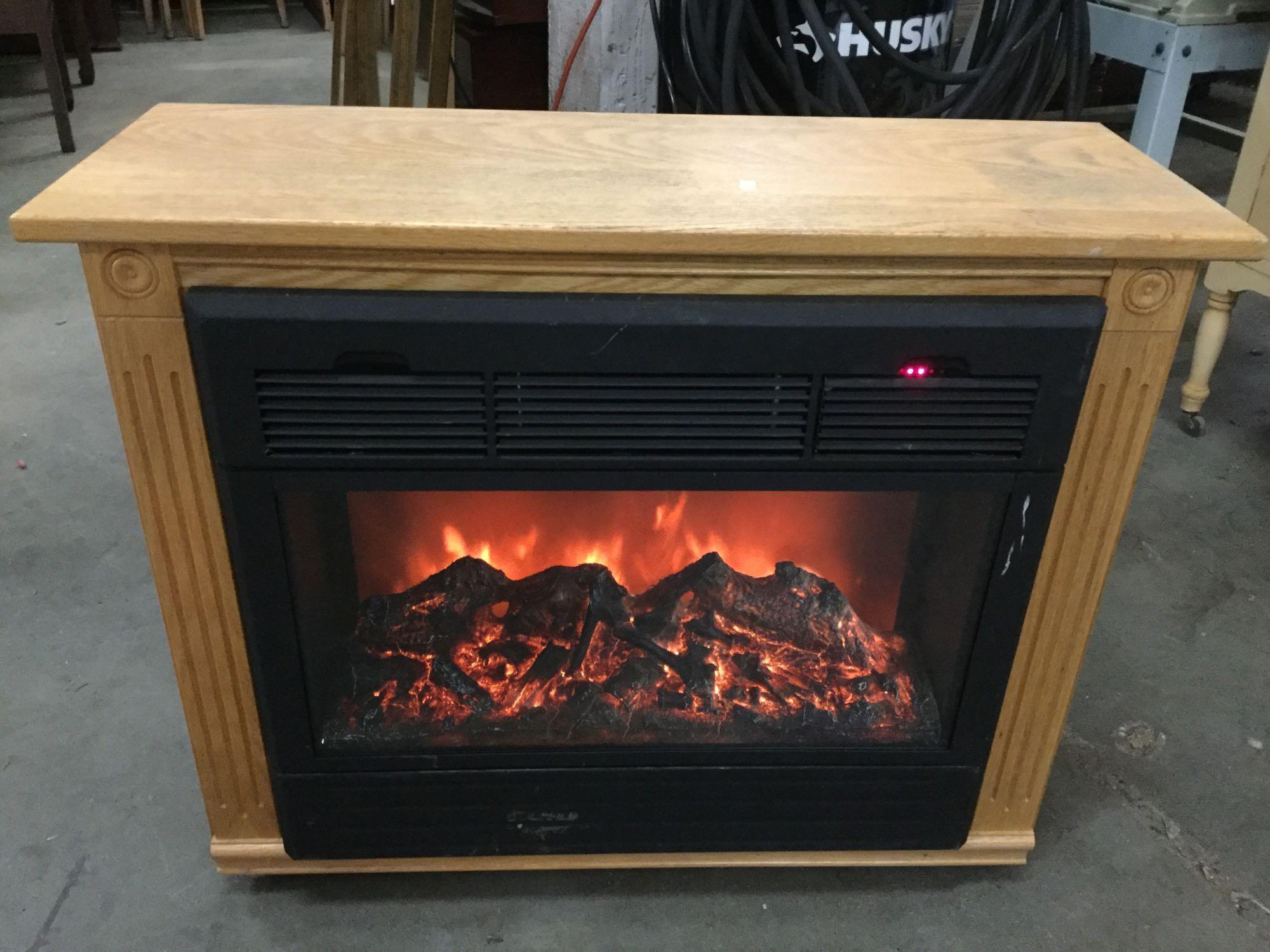 Heat Surge Electric Fireplace, model number ADL ? | Proxibid