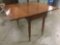 Antique mahogany drop leaf table - with casters