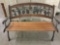 Vintage cast iron and wood park bench with leaf back relief
