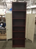 Tall mahogany stained skinny bookshelf with 6 shelves