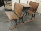 Antique school desk on slats with 2 folding seats - cast iron base