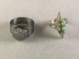 Pair of vintage sterling silver rings, 1 w/ colorful opal and the other w/ clear cut stones