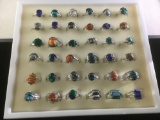 Collection of 36 new silver plated estate rings w/ colorful natural stone settings