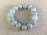 Fine quality carved jadeite bead bracelet w/ various shades of green