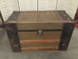 Antique flat top steamer trunk with leather handles
