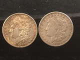 2 silver Morgan dollars, 1880-O and a 1921-P